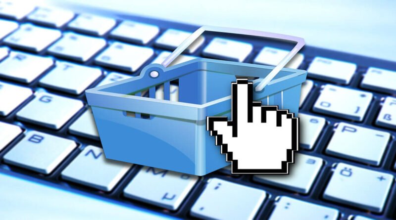 Online shopping basket on a keyboard representing emotional spending and impulsive online purchases during low moods