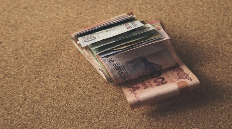 person thinking about money habits and how to stop overspending in daily life